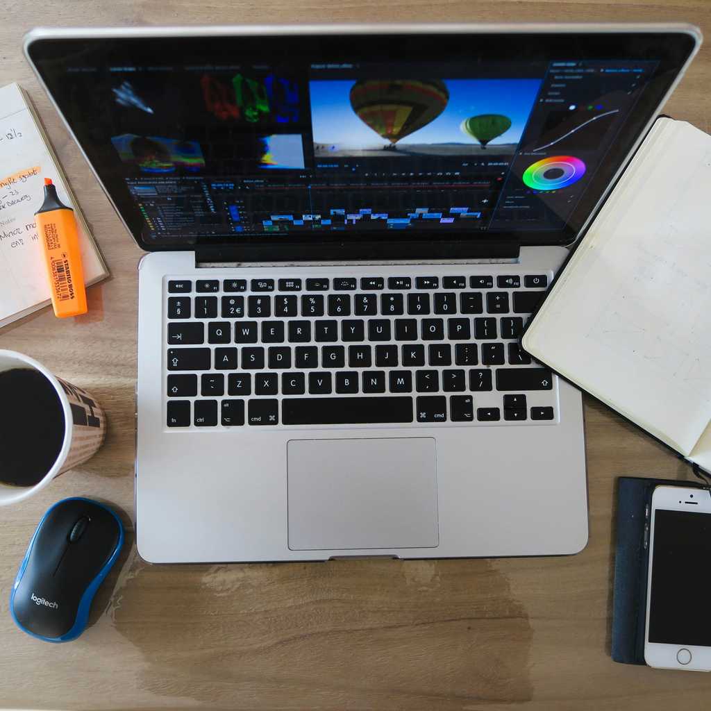 Laptop, notebooks, coffee and mobile phone